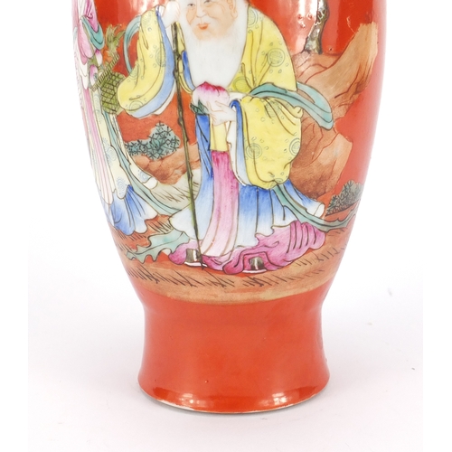 2156 - Chinese porcelain iron red ground vase, hand painted in the famille rose palette with Shou Lau holdi... 