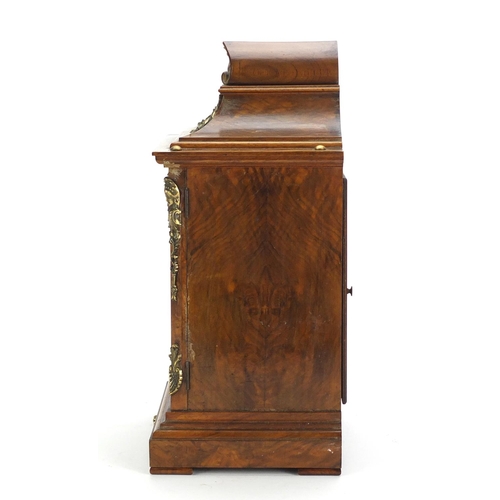 2048 - Burr walnut cased bracket clock, with gilt brass mounts striking on two gongs, the ornate face havin... 