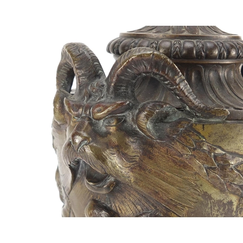 2109 - 19th century classical patinated bronze urn and cover with rams head handles, cast in relief with fr... 