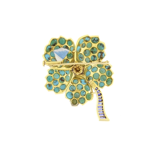 2560 - Multi gem flower head brooch set with sapphires, turquoise and a central cabochon ruby, impressed Tr... 