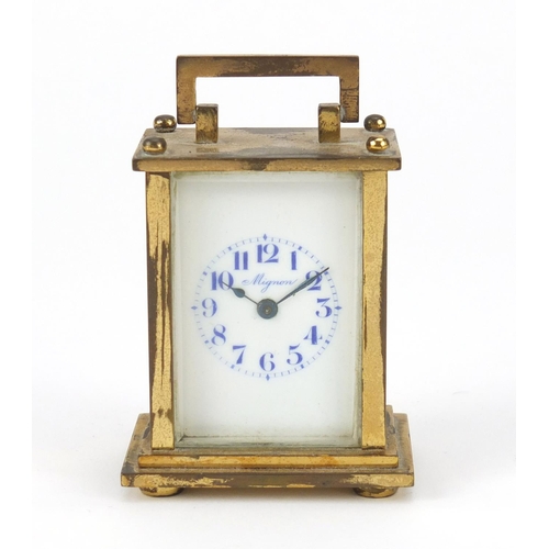 2070 - Miniature brass cased carriage clock with enamelled dial inscribed Mignon, 6.5cm high