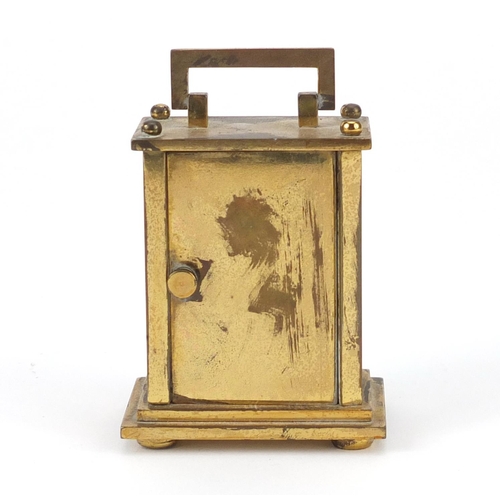 2070 - Miniature brass cased carriage clock with enamelled dial inscribed Mignon, 6.5cm high