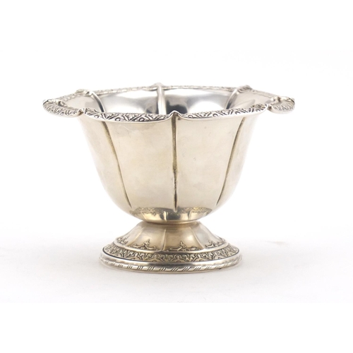 2542 - American sterling silver footed bowl, embossed with stylised motifs, 8cm high, 113.5g
