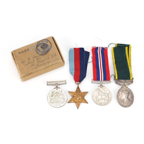 2477 - British Military World War II medal group including Territorial Efficient service medal, awarded to ... 
