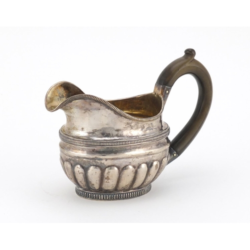 2500 - Russian silver sauce boat with demi fluted body, impressed marks to the base, 1887, 15cm in length, ... 