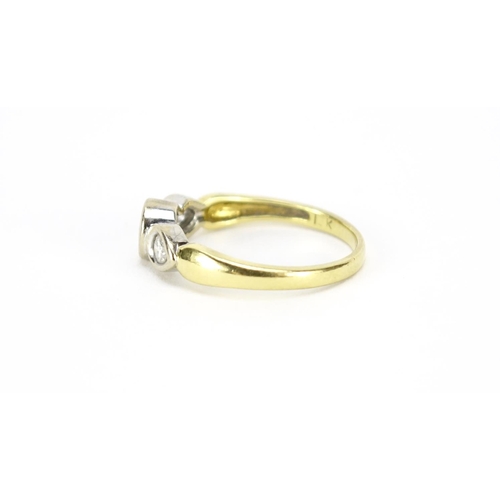 2563 - 18ct gold diamond three stone ring, size K, 2.7g