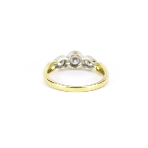 2563 - 18ct gold diamond three stone ring, size K, 2.7g