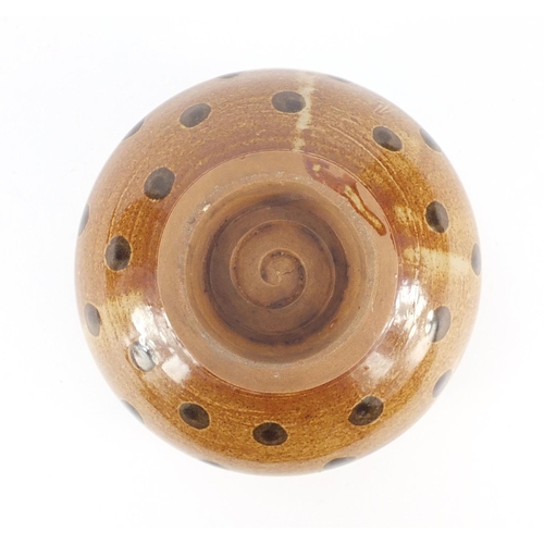 319 - Chinese porcelain squatted vase with twin handles having a brown glaze, 10cm high