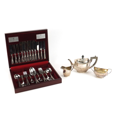 182 - Silver plated three piece tea set and a forty four piece canteen of stainless steel cutlery by Viner... 