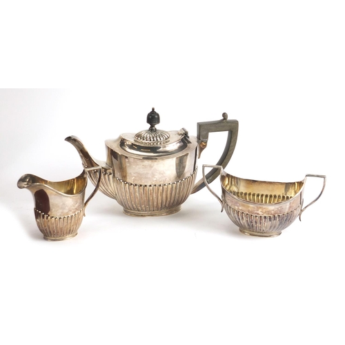 182 - Silver plated three piece tea set and a forty four piece canteen of stainless steel cutlery by Viner... 