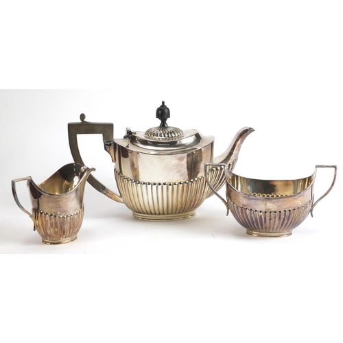 182 - Silver plated three piece tea set and a forty four piece canteen of stainless steel cutlery by Viner... 