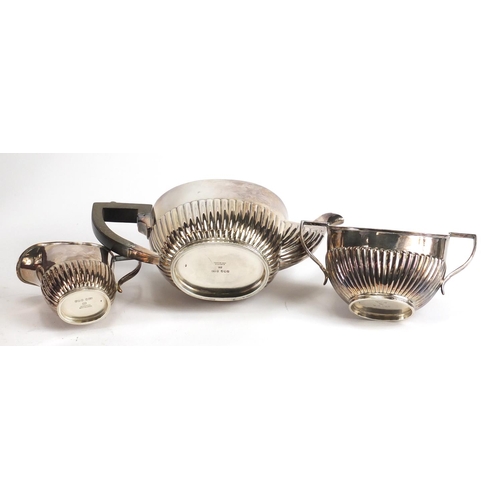 182 - Silver plated three piece tea set and a forty four piece canteen of stainless steel cutlery by Viner... 