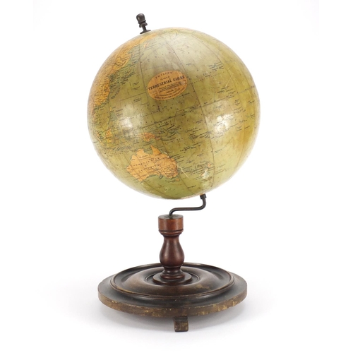 2100 - Philips 12inch terrestrial globe raised on a stained mahogany base, 52cm high