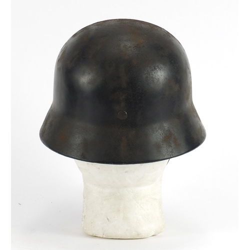 2464 - German Military interest tin helmet with decals and leather liner, inscriptions and impressed marks ... 