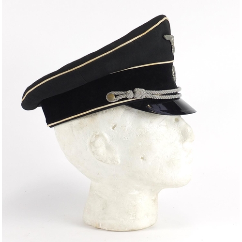 2472 - German Military interest visor cap with badges
