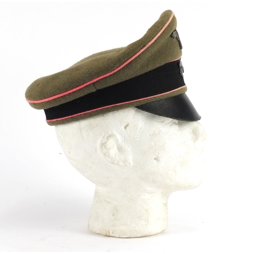 2473 - German Military interest visor cap with badges