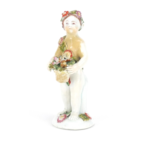 2118 - 18th century Bow hand painted figure of putti holding flowers, 12.5cm high