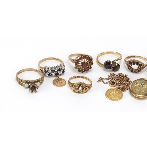 2562 - Mostly gold jewellery including four 9ct gold rings, St Christopher pendants, unmarked gold garnet r... 