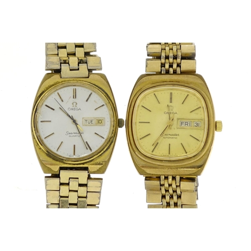 2571 - Two vintage Omega Seamaster wristwatches with day date dials, each approximately 3.2cm in diameter