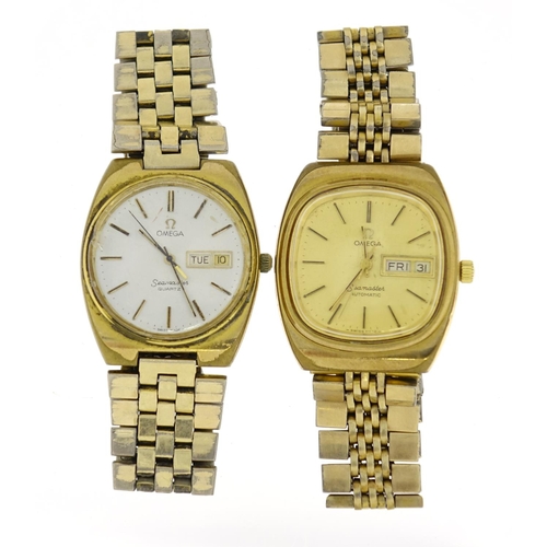 2571 - Two vintage Omega Seamaster wristwatches with day date dials, each approximately 3.2cm in diameter