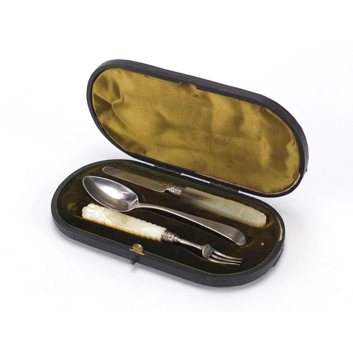 2531 - Matched Georgian silver knife, fork and spoon Christening set, housed in a tooled leather case, the ... 