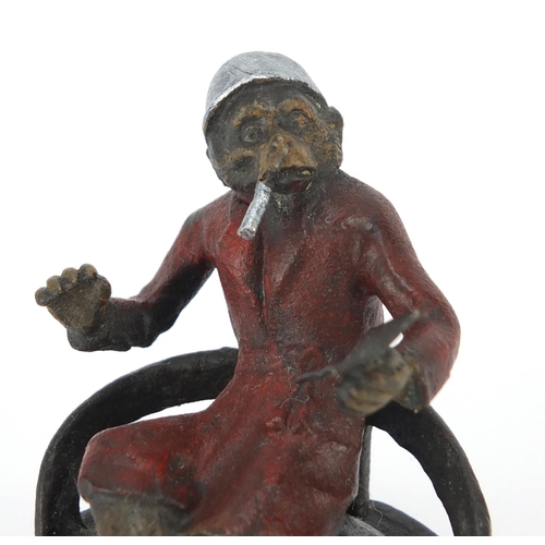 2119 - Cold painted bronze figure of a monkey smoking in the style of Franz Xaver Bergmann, raised on a cir... 
