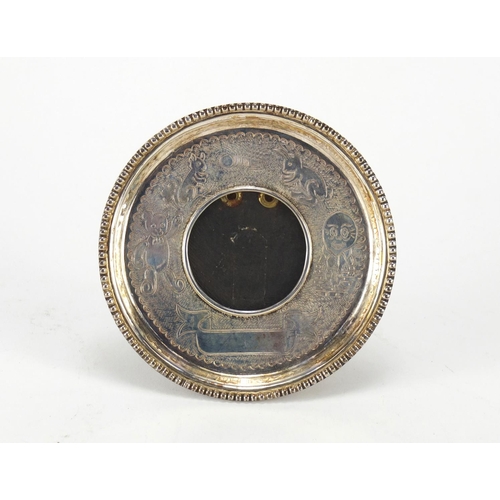 2508 - Circular sterling silver nursery rhyme easel photo frame, 10.5cm in diameter