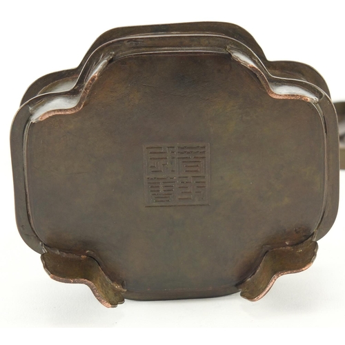 2111 - Chinese patinated bronze three section container, character marks to the base, 9.5cm high