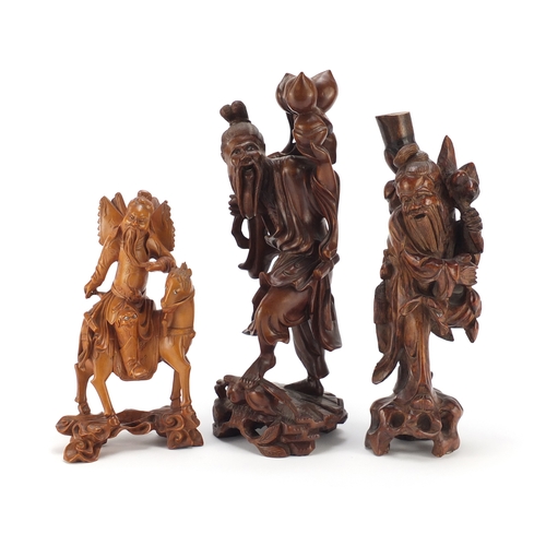 2321 - Chinese hardwood root carvings including one of an elder holding peaches, 36cm high