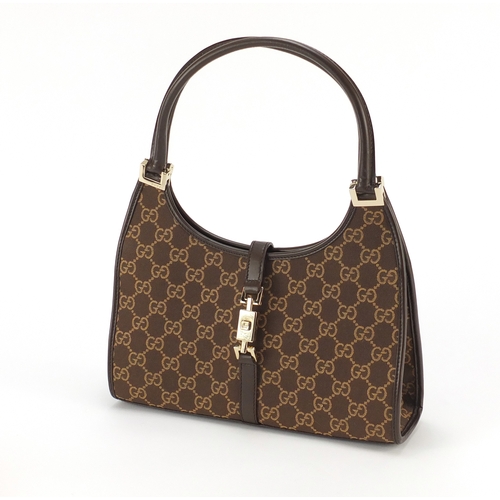 2137 - Vintage Gucci monogramed handbag with dust bag, 26.5cm wide