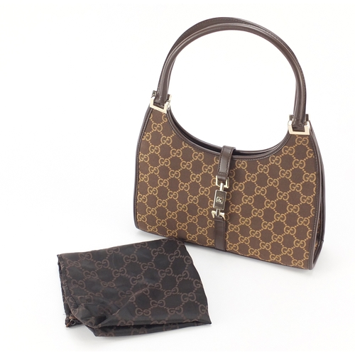 2137 - Vintage Gucci monogramed handbag with dust bag, 26.5cm wide