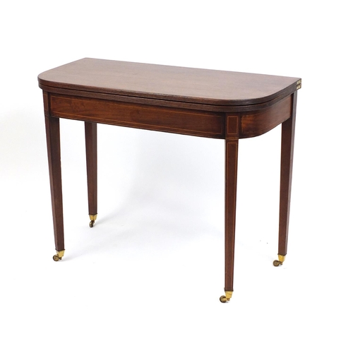 2014 - Edwardian inlaid mahogany fold over tea table, raised on tapering legs, 72cm H x 91cm W x 45cm D (fo... 