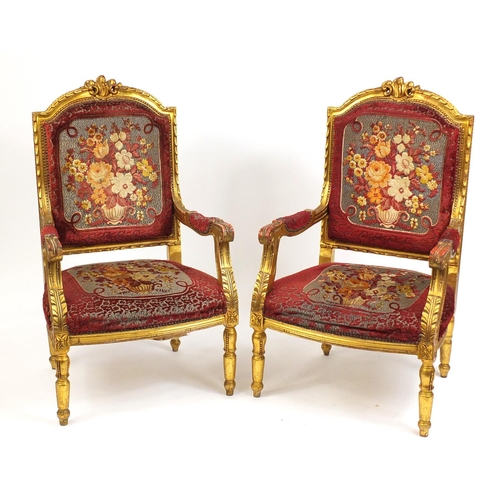 2015 - Pair of French design gilt wood elbow chairs with red and floral upholstery, 111cm high