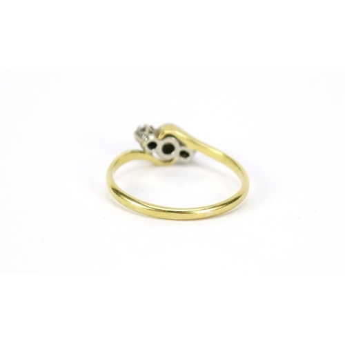2573 - 18ct gold diamond three stone crossover ring, size N, 2.1g