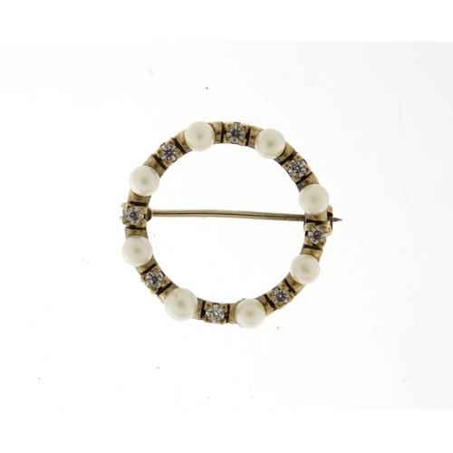 2581 - 9ct gold seed pearl and clear stone wreath brooch, 2.2cm in diameter, 3.2g