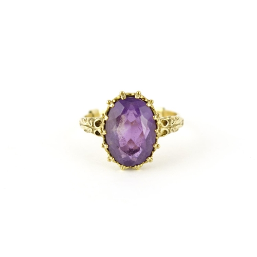 2609 - 9ct gold amethyst solitaire ring with ornate shoulders, size U, 5.2g
