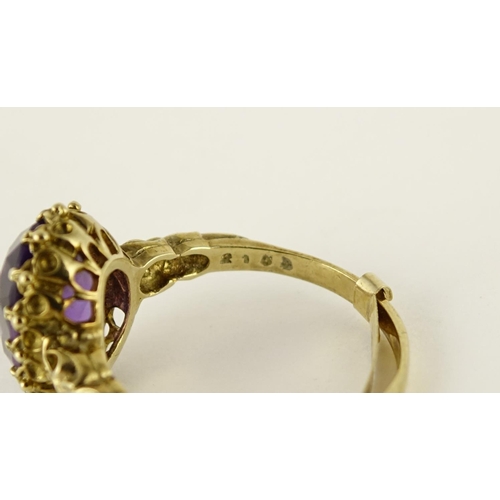 2609 - 9ct gold amethyst solitaire ring with ornate shoulders, size U, 5.2g