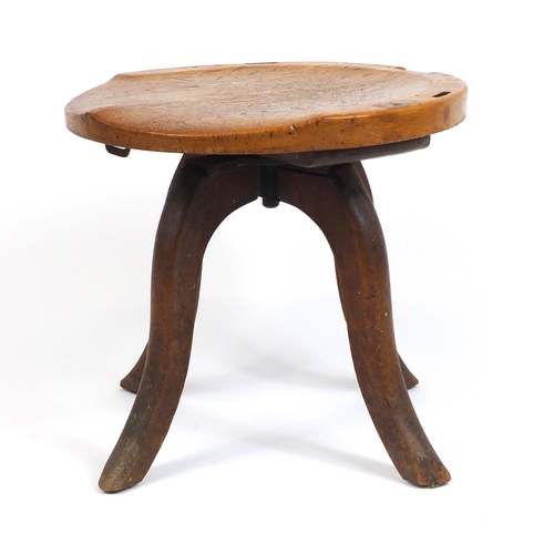 145 - Oak swivel stool, 44cm high x 50cm in diameter