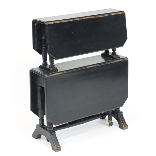 99 - Ebonised Edwardian two tier folding table, 75cm high