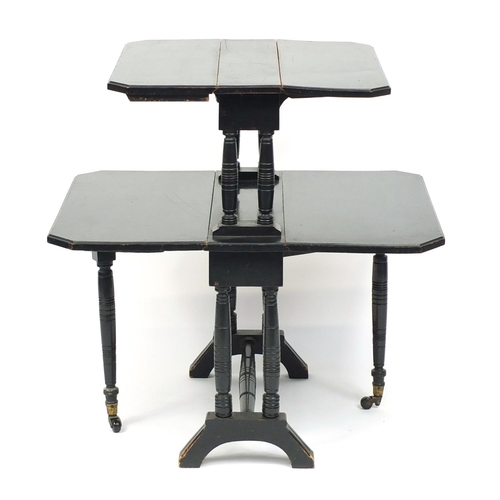 99 - Ebonised Edwardian two tier folding table, 75cm high