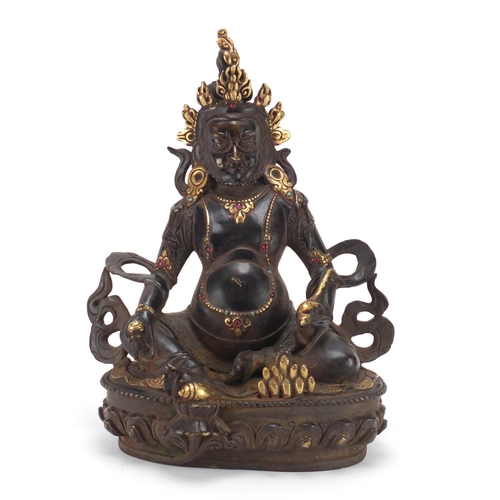 385 - Chino Tibetan partially gilt bronze figure of Buddha with a rat, 31cm high