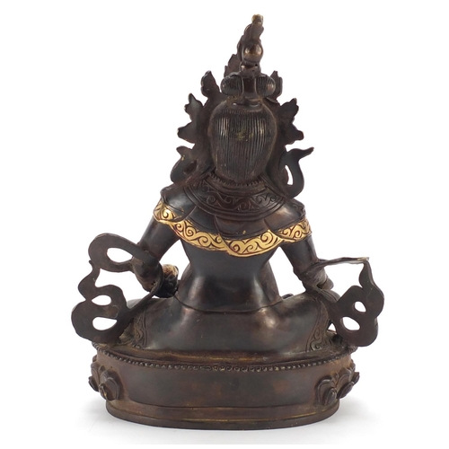 385 - Chino Tibetan partially gilt bronze figure of Buddha with a rat, 31cm high