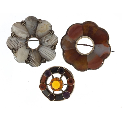 676 - Two Scottish unmarked silver agate brooches and one other, one set with semi precious stones, the la... 