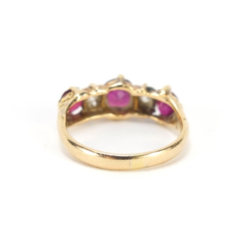 664 - Unmarked gold, ruby and diamond five stone ring with scroll settings, size L, 3.1g