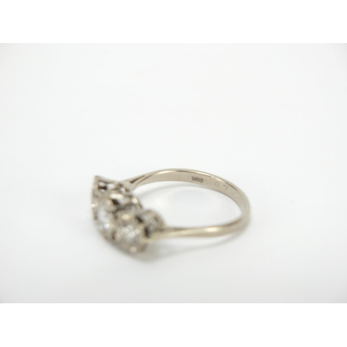 650 - 18ct white gold diamond three stone ring, housed in a Munsey & Co leather box, London 1973, size N, ... 