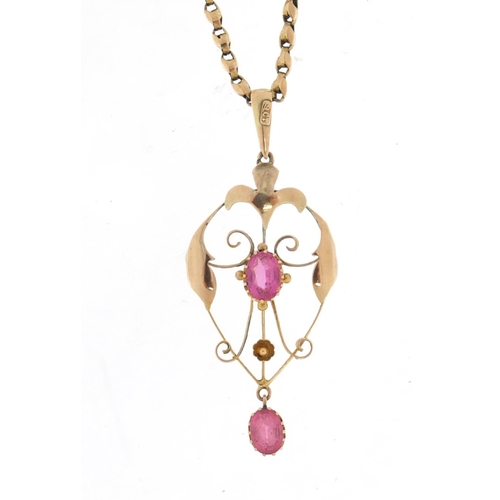 652 - Art Nouveau unmarked gold pendant, set with pink stones on a 9ct gold necklace, the pendant 5.5cm in... 