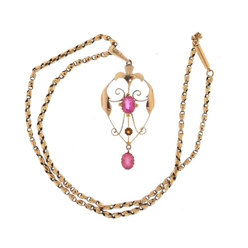 652 - Art Nouveau unmarked gold pendant, set with pink stones on a 9ct gold necklace, the pendant 5.5cm in... 