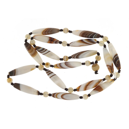 696 - Islamic agate elongated bead necklace, 60cm in length, 44.2g