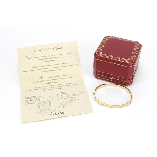 672 - ** WITHDRAWN ** 18ct gold Cartier Love bangle with box and certificate, numbered CXH609, the bangle ... 