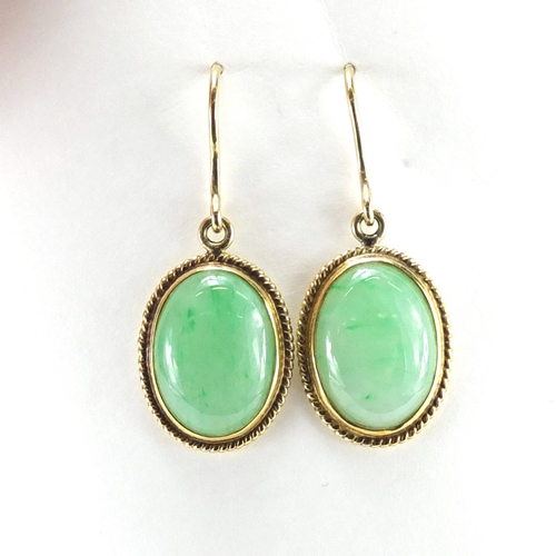 691 - Pair of unmarked gold green cabochon jade earrings (tests as 14ct+) 3.5cm in length, 5.0g